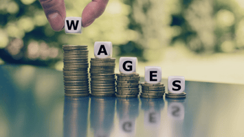 Coins forming the word wages